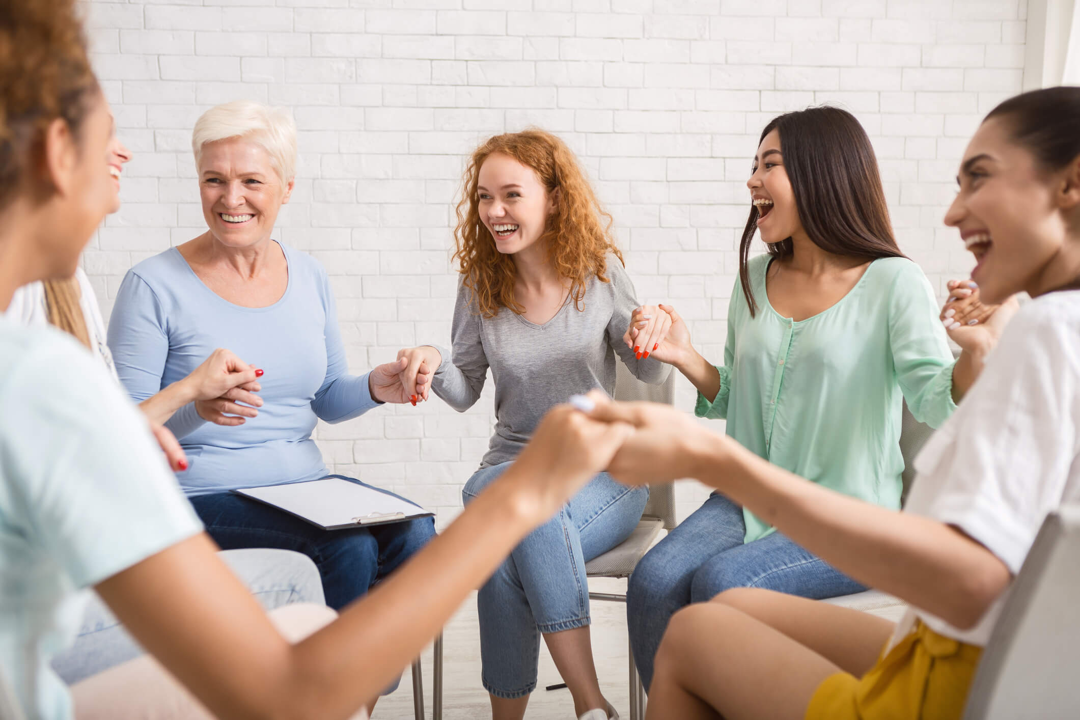 Group of women enjoying a life coaching session together | Best Life Coaches in Manchester & London | Life Coach 4U